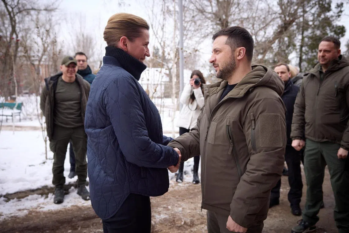 Denmark's Ms Frederiksen (left) is welcomed in Mykolaiv by Mr Zelensky, before visiting Ukrainian servicemen at a military hospital.