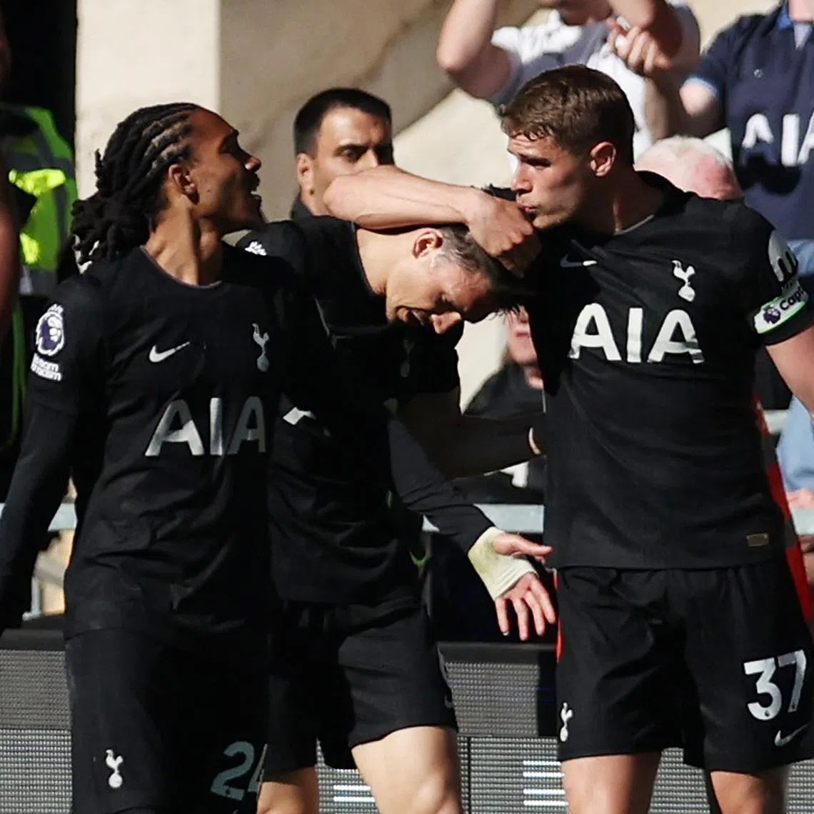 Soccer Football - Premier League - Wolverhampton Wanderers v Tottenham Hotspur - Molineux Stadium, Wolverhampton, Britain - April 25, 2026 Tottenham Hotspur's Joao Palhinha celebrates scoring their first goal with Micky van de Ven and Djed Spence REUTERS/Chris Radburn