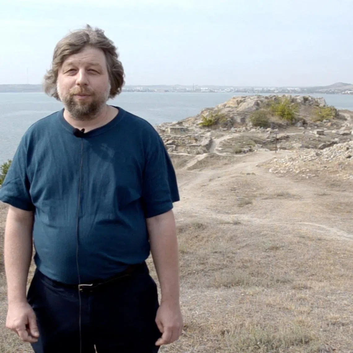 FILE PHOTO: Alexander Butyagin, a Russian archaeologist and head of the Mirmeki Expedition of the State Hermitage, speaks during the filming of a scientific and educational documentary about Mirmekion, an ancient Greek settlement located in modern-day Kerch, Crimea, in this still image from a video released in January 2021. Eastern-Crimean Historical and Cultural Museum-Preserve/Handout via REUTERS