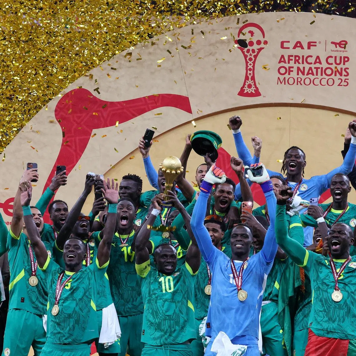 Soccer Football - CAF Africa Cup of Nations - Morocco 2025 - Final - Senegal v Morocco - Prince Moulay Abdellah Stadium, Rabat, Morocco - January 18, 2026 Senegal's Sadio Mane lifts the trophy with teammates as they celebrate after winning the Africa Cup of Nations REUTERS/Amr Abdallah Dalsh