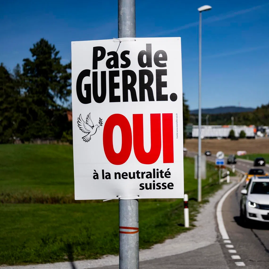 A campaign poster reading “No war, Yes to Swiss neutrality” in Epagny, near Fribourg, Switzerland, on Sept 25.