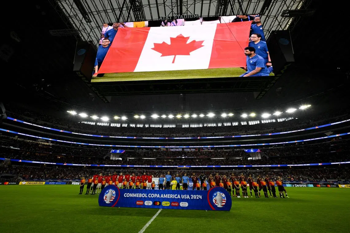 Jul 5, 2024; Arlington, TX, USA; A view of the fans and the flag during the playing of the national anthem of Canada before the game between Venezuela and Canada in the 2024 Copa America quarterfinal at AT&T Stadium. Mandatory Credit: Jerome Miron-USA TODAY Sports