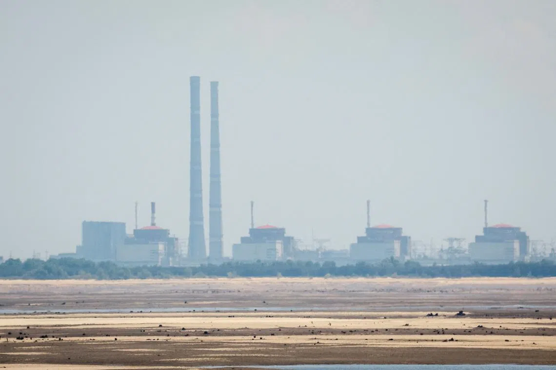 A view shows Zaporizhzhia Nuclear Power Plant from the bank of Kakhovka Reservoir near the town of Nikopol, amid Russia's attack on Ukraine, in Dnipropetrovsk region, Ukraine June 16, 2023. REUTERS/Alina Smutko