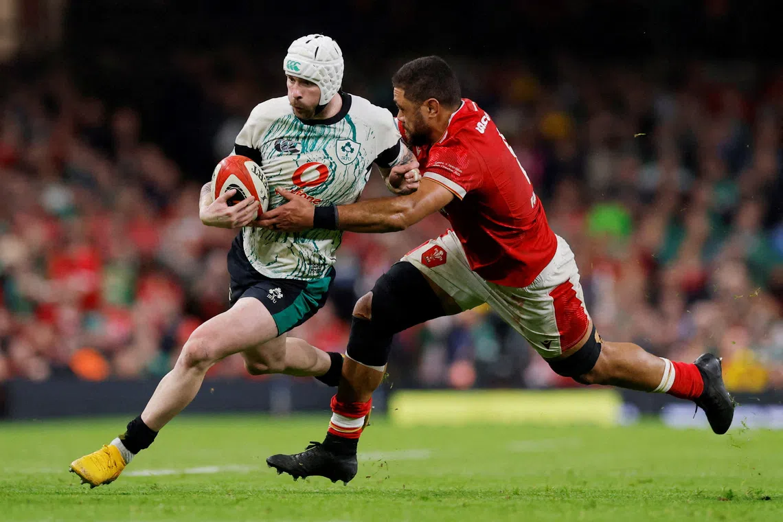 FILE PHOTO: Rugby Union - Six Nations Championship - Wales v Ireland - Millennium Stadium, Cardiff, Wales, Britain - February 22, 2025 Ireland's Mack Hansen in action with Wales' Taulupe Faletau Action Images via Reuters/Andrew Couldridge/File Photo