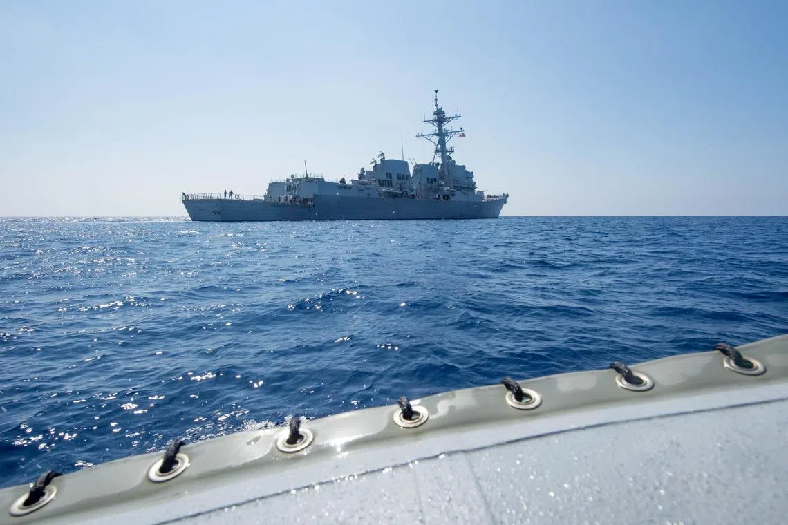 A photo dated May 6, 2017, shows Arleigh Burke-class guided-missile destroyer USS Dewey transiting the South China Sea.
