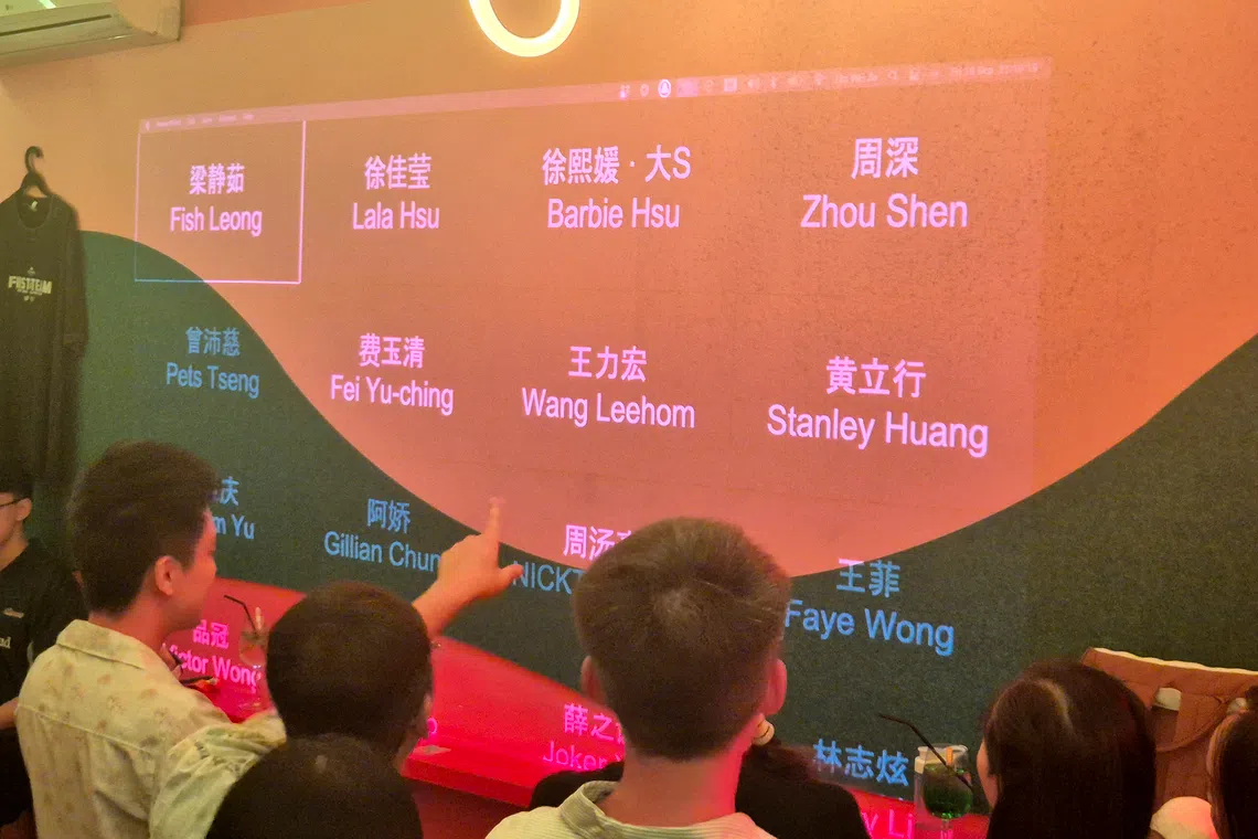 Participants of a recent Mandopop quiz at Slippery Slope had to group the singers named on the screen according to themes.