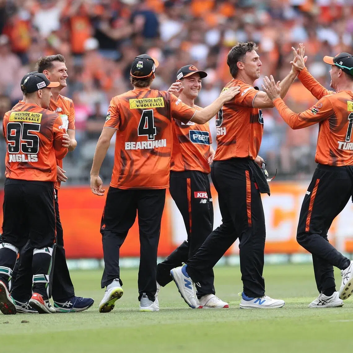Perth Scorchers' Mitchell Marsh celebrates with teammates after catching Sydney Sixers' Moises Henriques in the Big Bash League T20 final at the Optus Stadium in Perth on Jan 25, 2026.