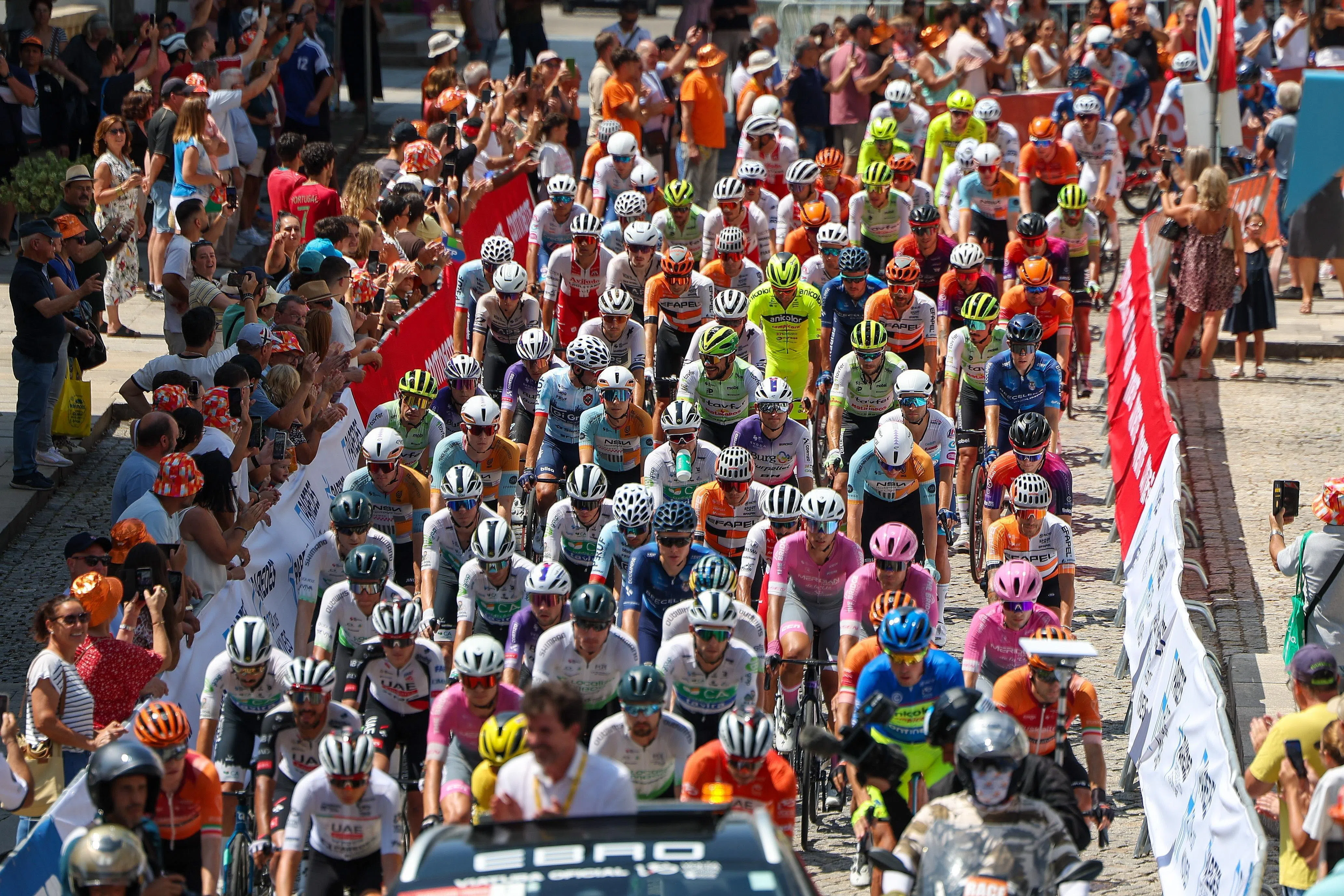 Riders setting off for the 8th stage of the Tour of Portugal. The stage was suspended with about 20km remaining following the death of Finlay Tarling.