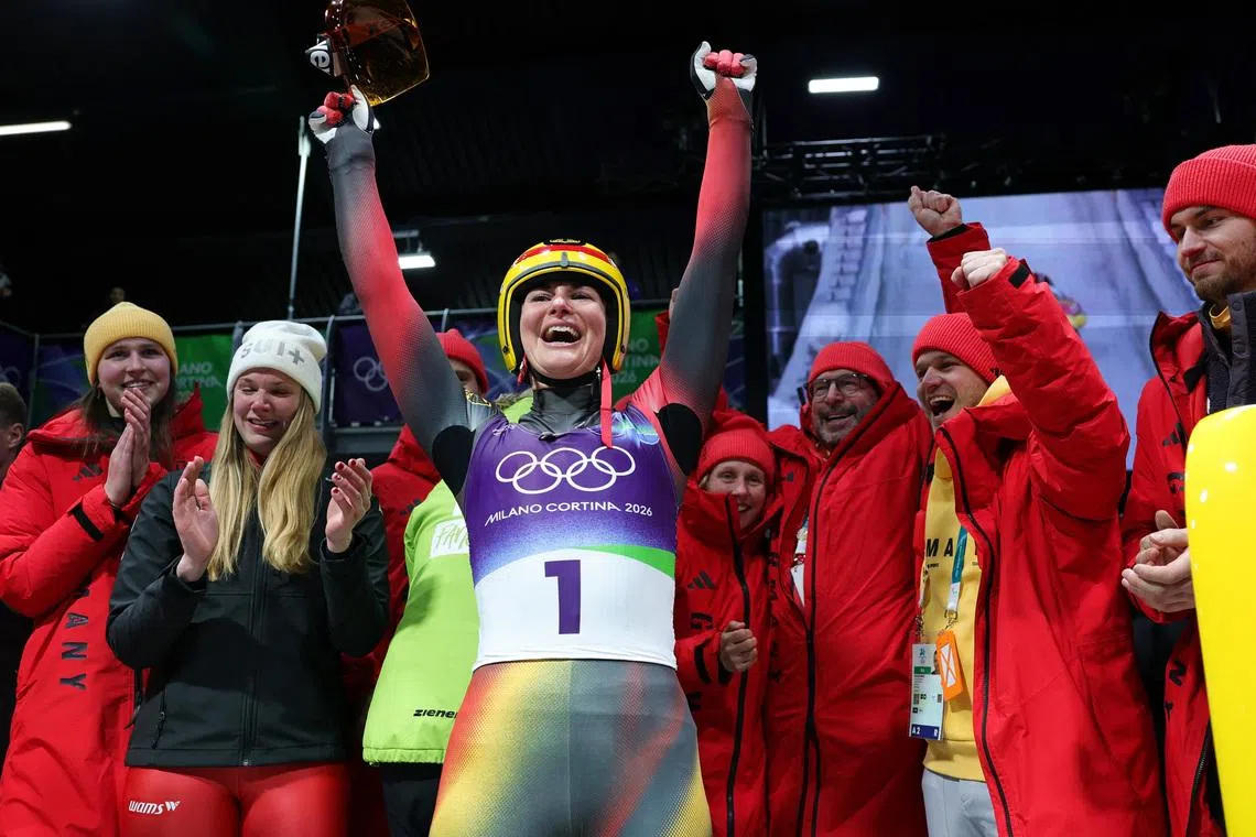 Milano Cortina 2026 Olympics - Luge - Women's Singles Run 4 - Cortina Sliding Centre, Cortina d'Ampezzo, Italy - February 10, 2026. Gold medallist Julia Taubitz of Germany celebrates after the Women's Singles REUTERS/Athit Perawongmetha