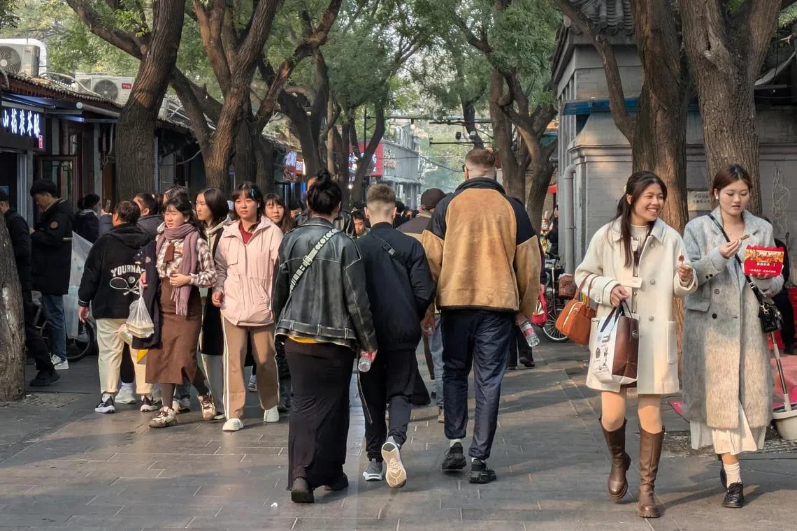 Tourists at one of Beijing's oldest alleys Nanluoguxiang on Nov 8.