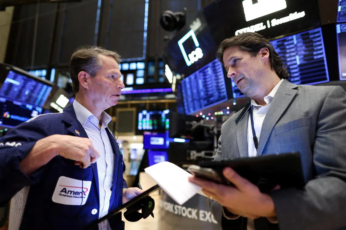 Traders work on the floor of the New York Stock Exchange.