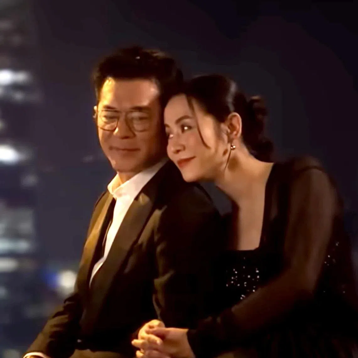 Louis Koo and Jessica Hsuan in the music video for Beyond Time And Space.