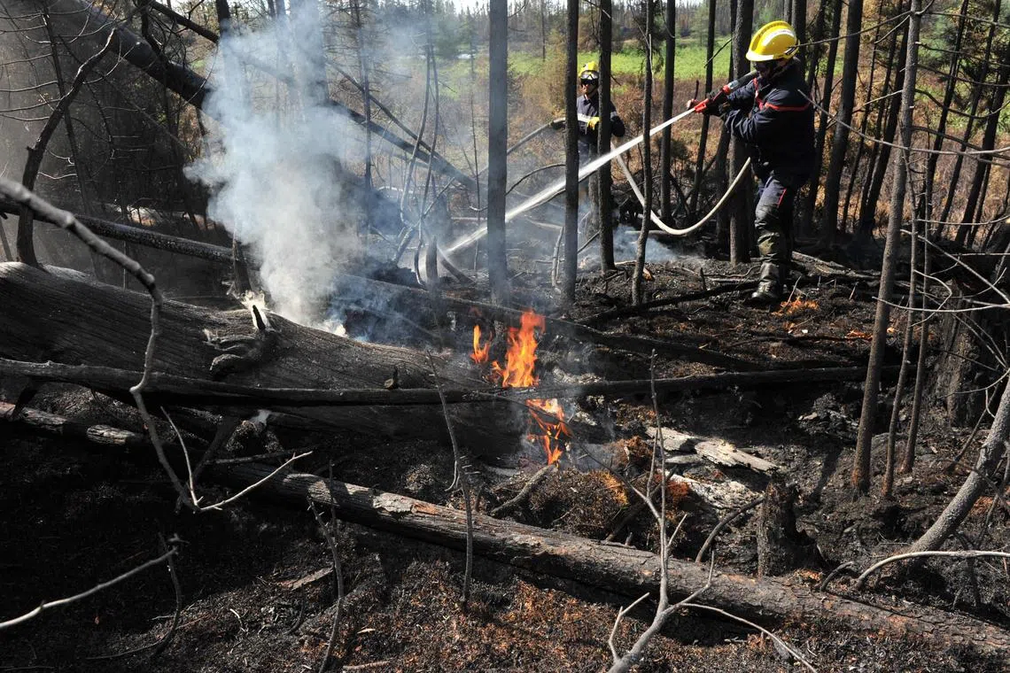 Two other firefighters have perished in separate operations this month, and a fourth person, a helicopter pilot, died July 19 when his aircraft crashed in Alberta, in western Canada, while taking part in relief operations.