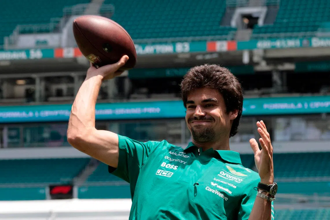 Formula One F1 - Miami Grand Prix - Miami, Florida, United States - April 30, 2026 Aston Martin's Lance Stroll plays American Football ahead of the Miami Grand Prix REUTERS/Brian Snyder