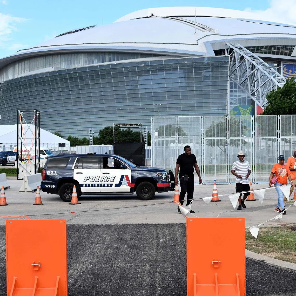 A police vehicle patrols near the high-security fences at the perimeter of AT&T Stadium ahead of the 2026 World Cup in Dallas on June 10.