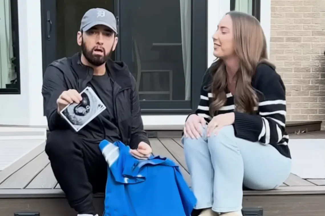 American Rapper Eminem's daughter Hailie Jade Mathers, surprises him with a Detroit Lions jersey emblazoned with “Grandpa” on the back. 
