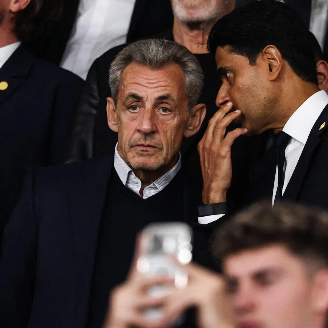 France’s former president Nicolas Sarkozy (left) and Paris Saint-Germain’s Qatari president Nasser al-Khelaifi speaking during the Champions League clash against Slovan Bratislava at the Parc des Princes in Paris on Sept 9.