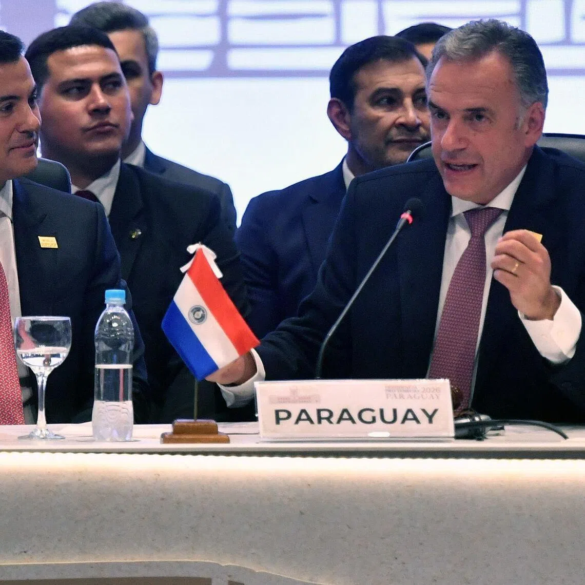 Uruguay's President Yamandu Orsi (R) speaks after passing the pro-tempore presidency to Paraguay's President Santiago Pena during the 68th Mercosur Heads of State summit at the Conmebol headquarters, in Luque, Paraguay on June 30, 2026. (Photo by DANIEL DUARTE / AFP)