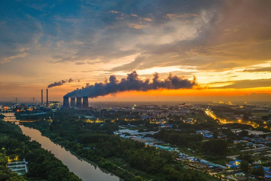 TOPSHOT - A general view photo shows the Huaneng coal-fired power plant in Huai'an, eastern China's Jiangsu province on July 23, 2026. (Photo by CN-STR / AFP) / China OUT