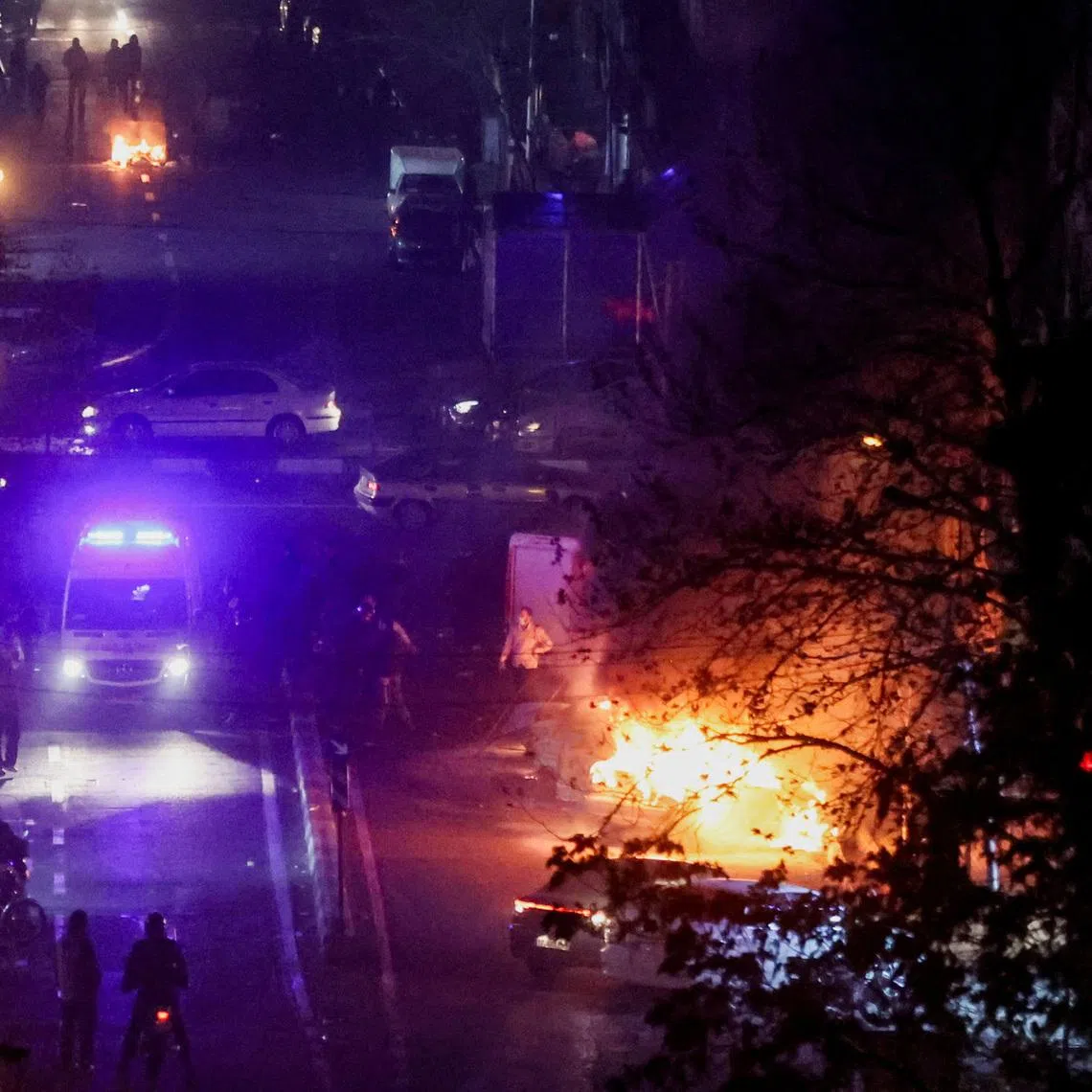 Cars burn in a street during a protest in Tehran, Iran, on Jan 8. Singapore's MFA said that those in Iran should avoid demonstrations and places where big crowds gather.