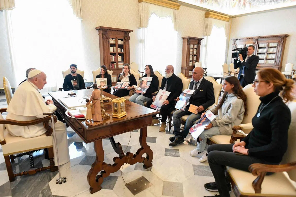 Members of five Israeli families had a private audience with Pope Francis on April 8, showing him posters of loved ones who were taken.
