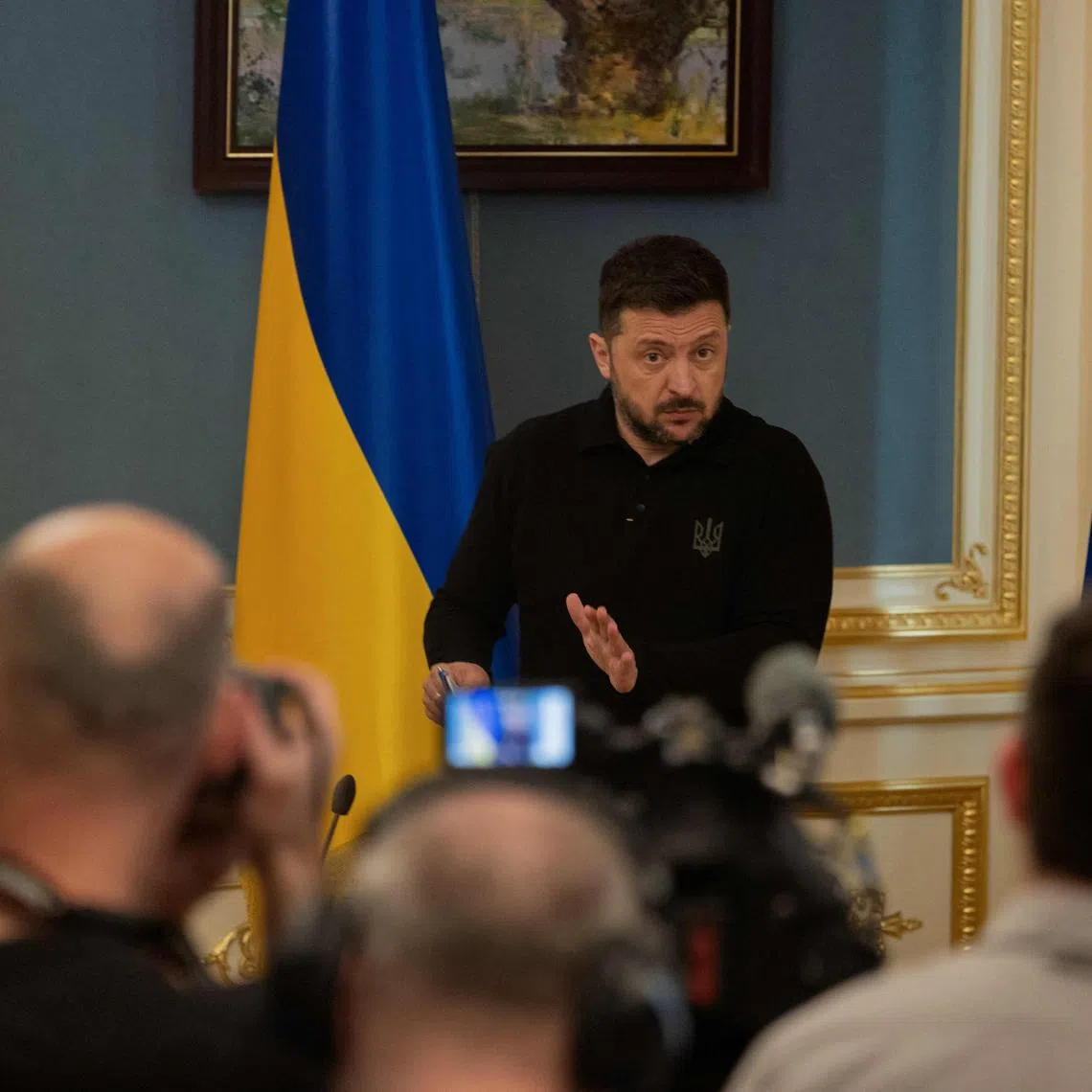 Ukraine's President Volodymyr Zelensky delivers a press conference in Kyiv on April 22, 2025, amid the Russian invasion of Ukraine. (Photo by Tetiana DZHAFAROVA / AFP)
