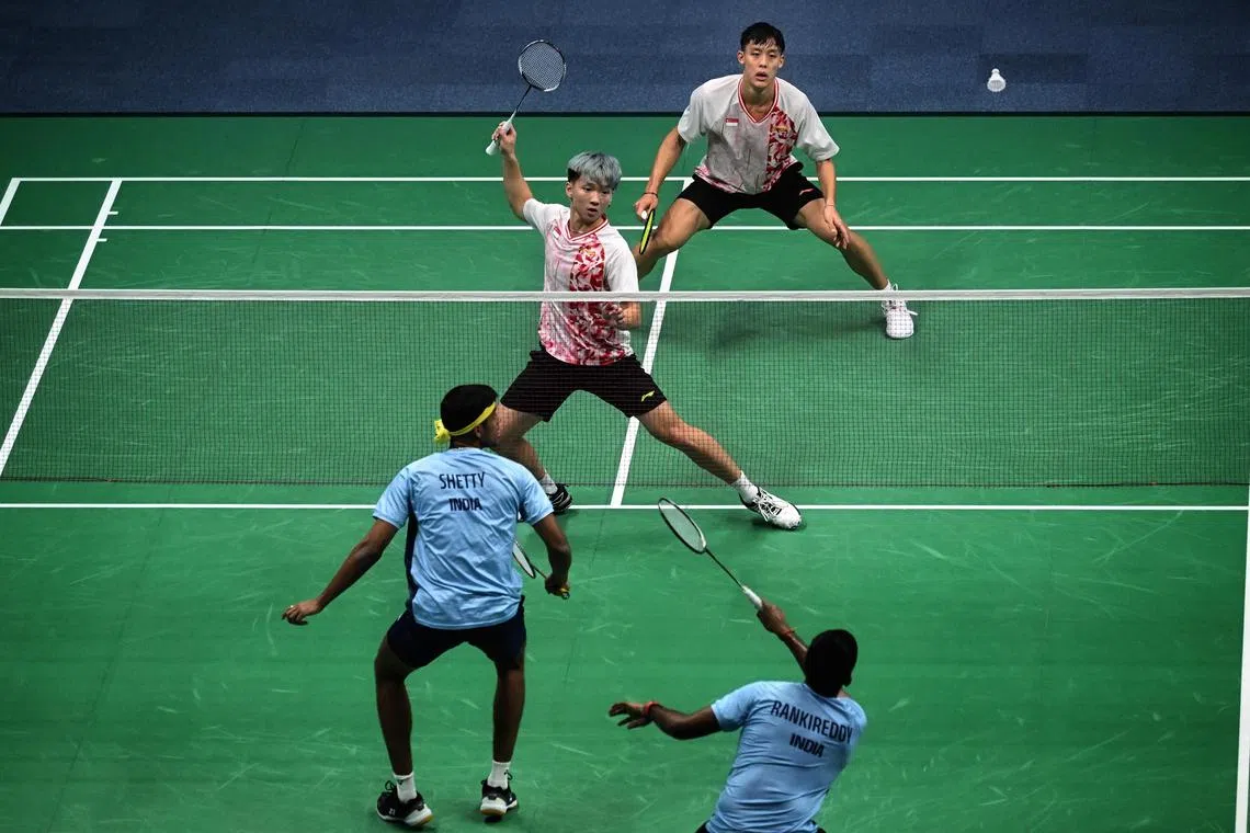 ST PHOTO: Chong Jun Liang

Nge Joo Jie (second from top) and Johann Pragjogo (top) of Singapore action against Satwiksairaj Rankireddy and Chirag Shetty of India during the men’s doubles quarterfinal in the 19th Asian Games held in Hangzhou, China on October 5, 2023