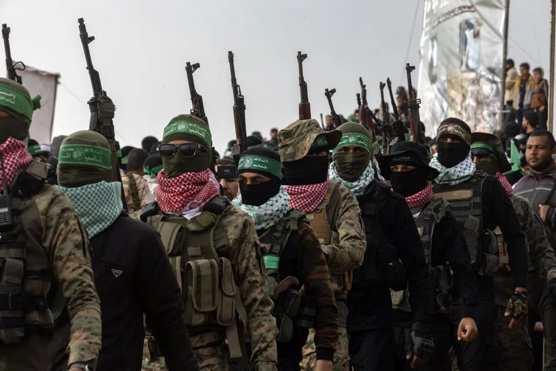 Armed members of Hamas in Khan Younis, in southern Gaza, on Feb 20, 2025. US President Donald Trump's Board of Peace is demanding that Hamas finalize an agreement to demilitarize Gaza.