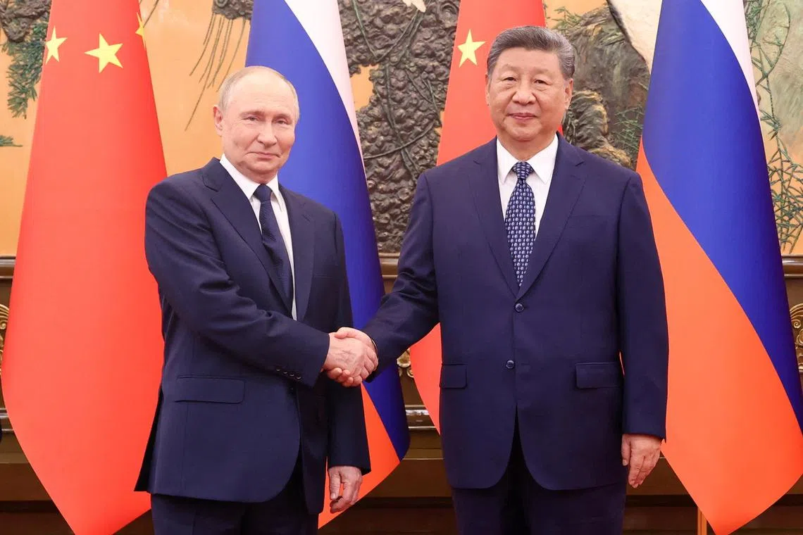 Chinese President Xi Jinping shakes hands with Russian President Vladimir Putin at the Great Hall of the People, in Beijing, China, September 2, 2025. China Daily via REUTERS