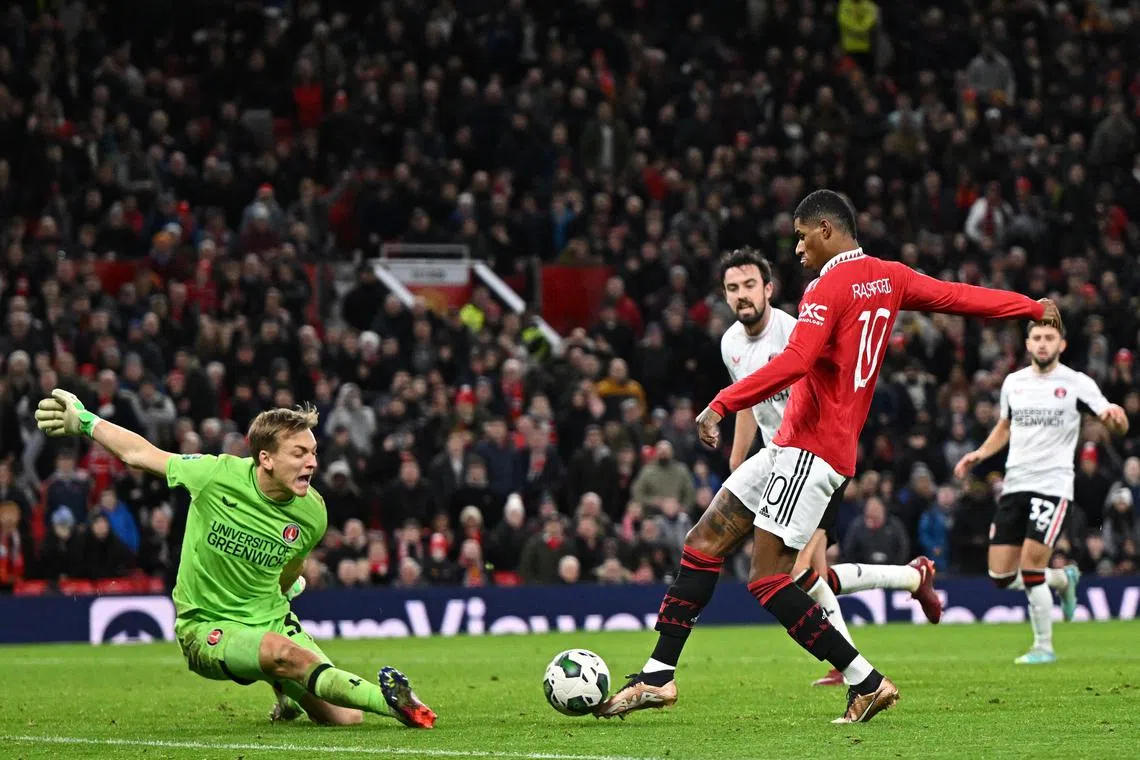 Manchester United's Marcus Rashford scores the team's second goal in the 3-0 League Cup quarter-final win over Charlton Athletic on Tuesday.