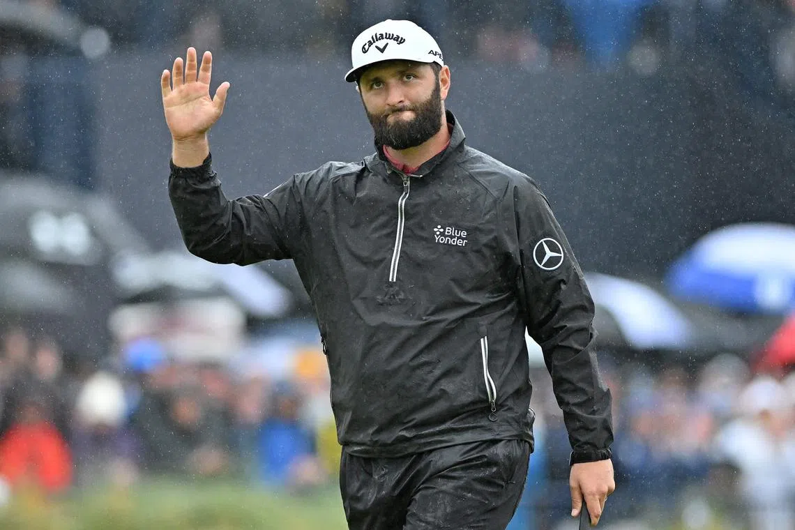 Spain's Jon Rahm celebrates his birdie putt on the 18th green on day four of the 151st British Open Golf Championship at Royal Liverpool Golf Course in Hoylake, north west England on July 23, 2023. (Photo by Glyn KIRK / AFP) / RESTRICTED TO EDITORIAL USE