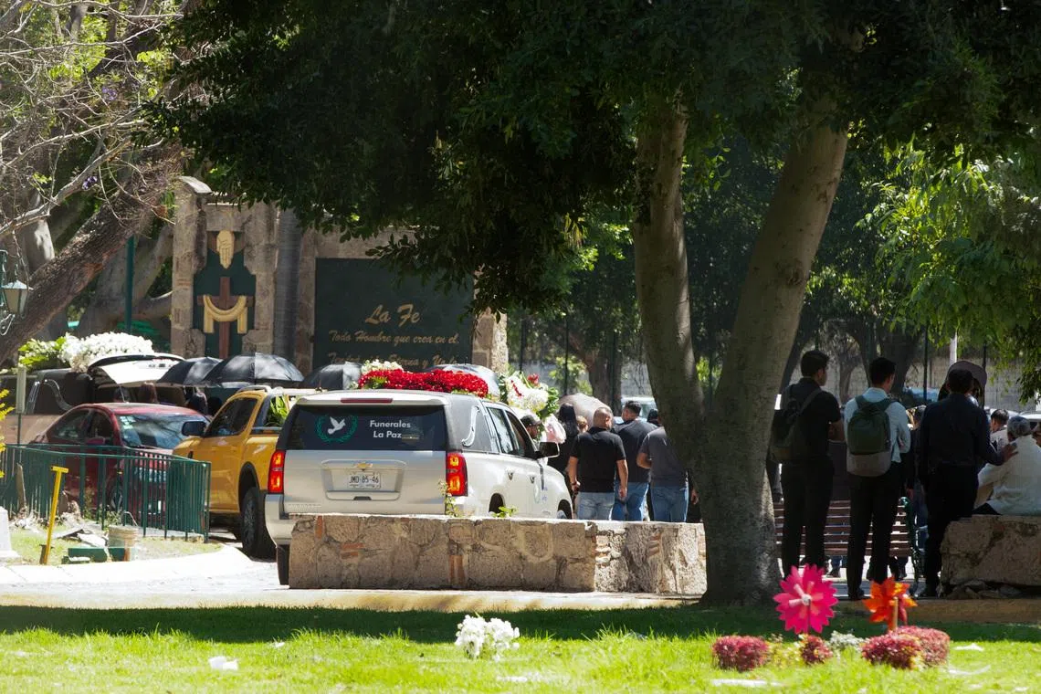 People arrive to the Recinto de la Paz cemetery, where, according to local media, the body of cartel leader Nemesio Oseguera Cervantes, known as “El Mencho,” who was killed on February 22 in a military operation in the state of Jalisco, was brought following his wake, in Zapopan, Mexico, March 2, 2026. REUTERS/Stringer