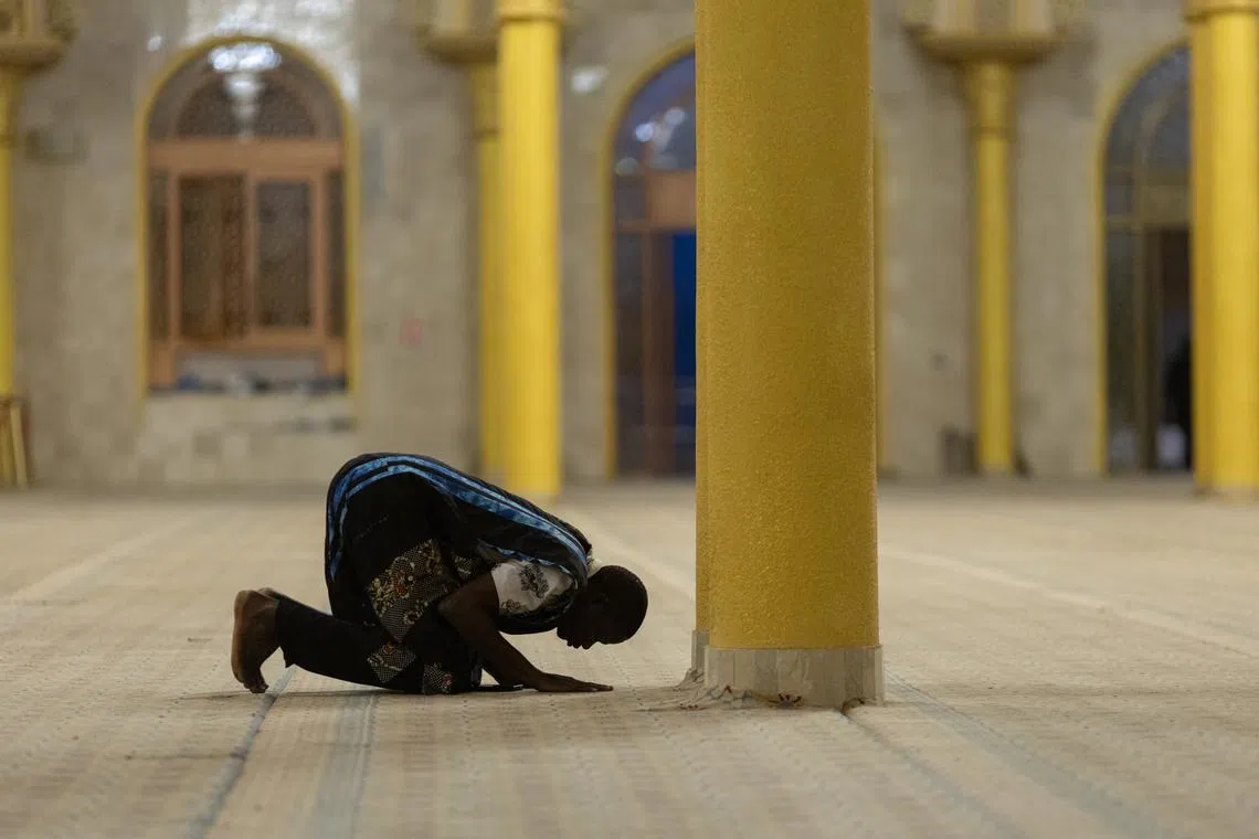 A worshipper praying at the Massalikoul Djinane mosque in Dakar, Senegal, on Mar 11, 2024. Muslims worldwide are expected to start observing Ramadan fasting and rites related to it on 11 March. 