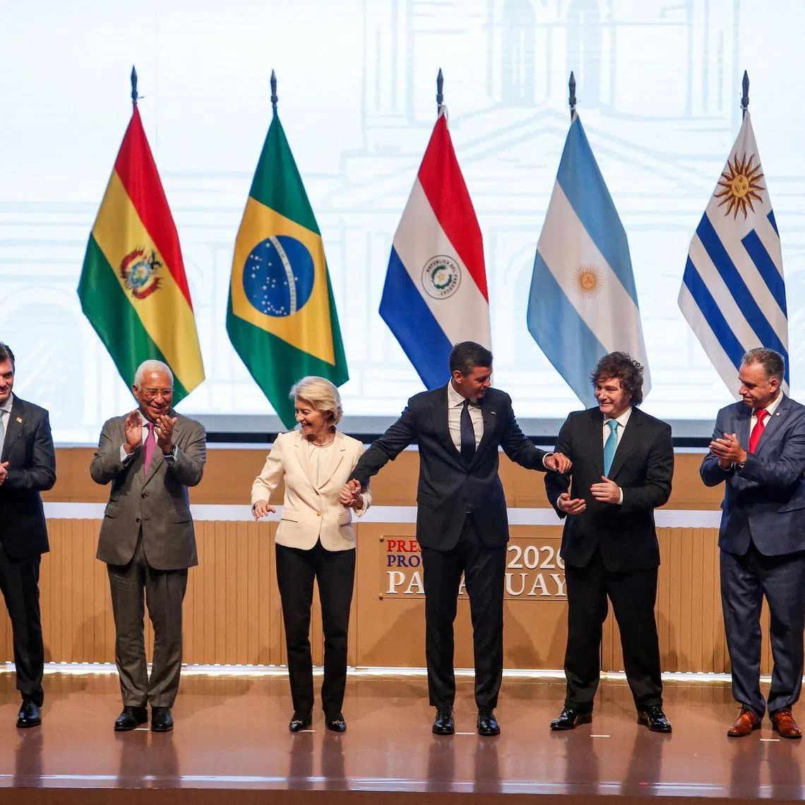 Panama's President Jose Raul Mulino, Bolivia's President Rodrigo Paz, European Council President Antonio Costa, European Commission President Ursula von der Leyen, Paraguay's President Santiago Pena, Argentina's President Javier Milei, Uruguay's President Yamandu Orsi and Brazil's Foreign Minister Mauro Vieira during the signing ceremony of a free trade agreement between the European Union and the South American bloc Mercosur, ending more than 25 years of negotiations, in Asuncion, Paraguay, January 17, 2026. REUTERS/Cesar Olmedo