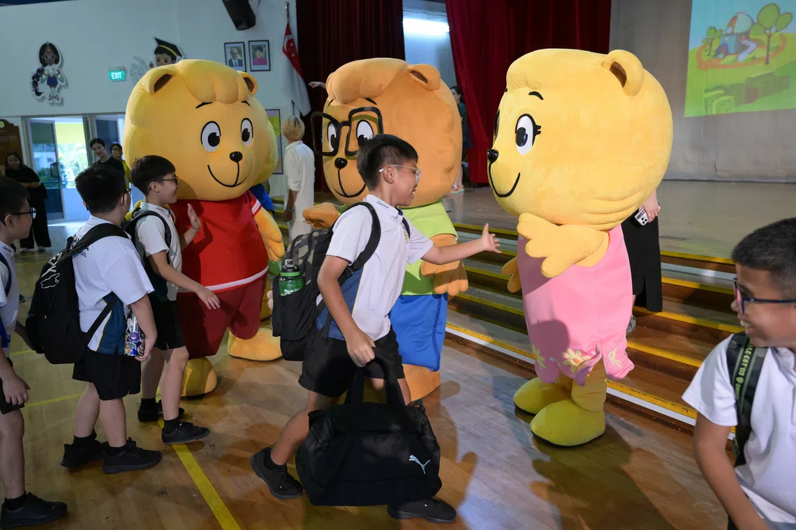 Lianhua Primary School pupils greeting the Singapore Kindness Movement's Kindness Cubbies during the school's celebration of Kindness Day on May 13.