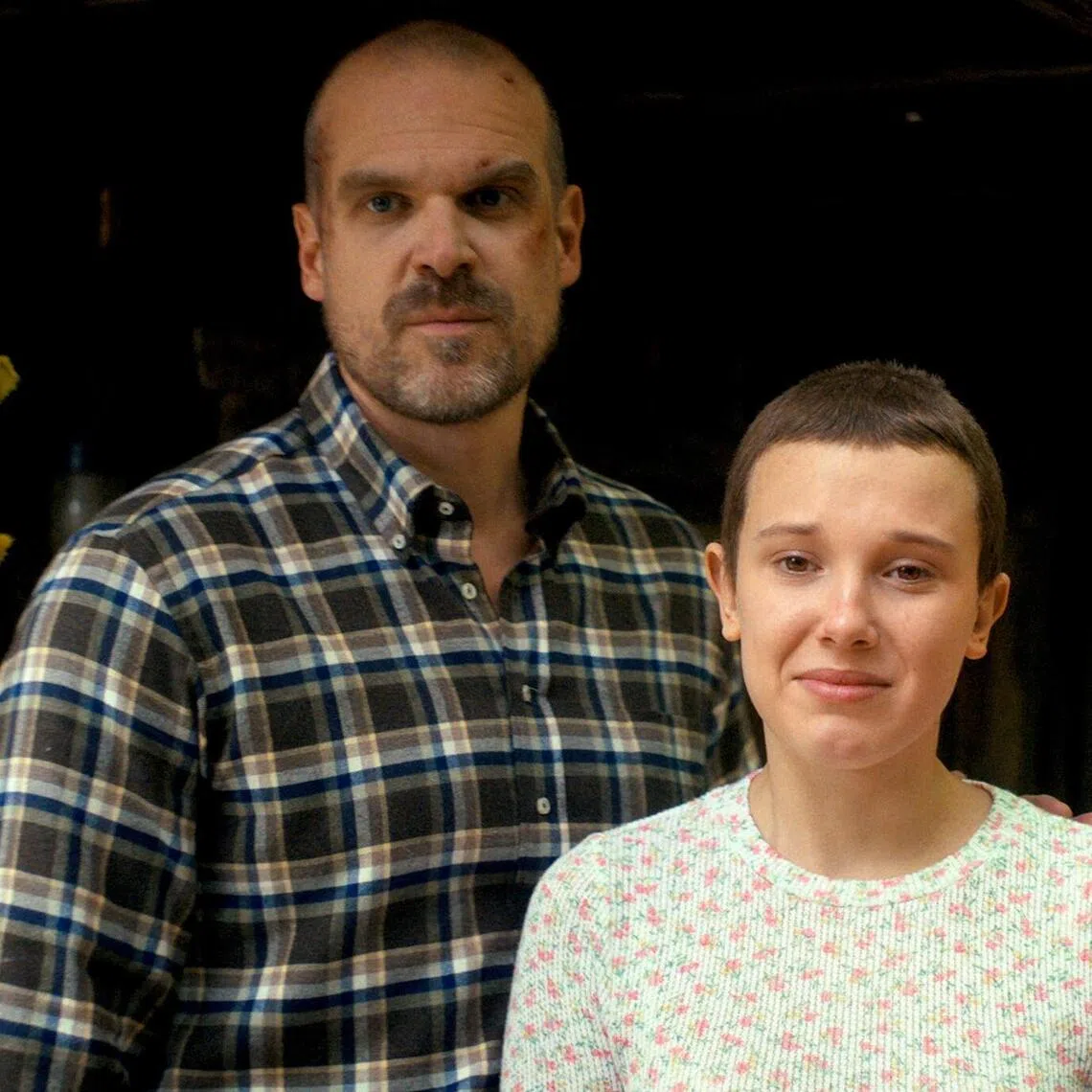 Millie Bobby Brown (right) and David Harbour play daughter and father in Stranger Things.