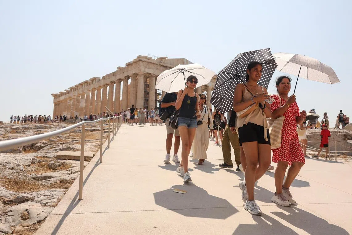 Tourists visiting the Acropolis in Athens, Greece, on July 21.