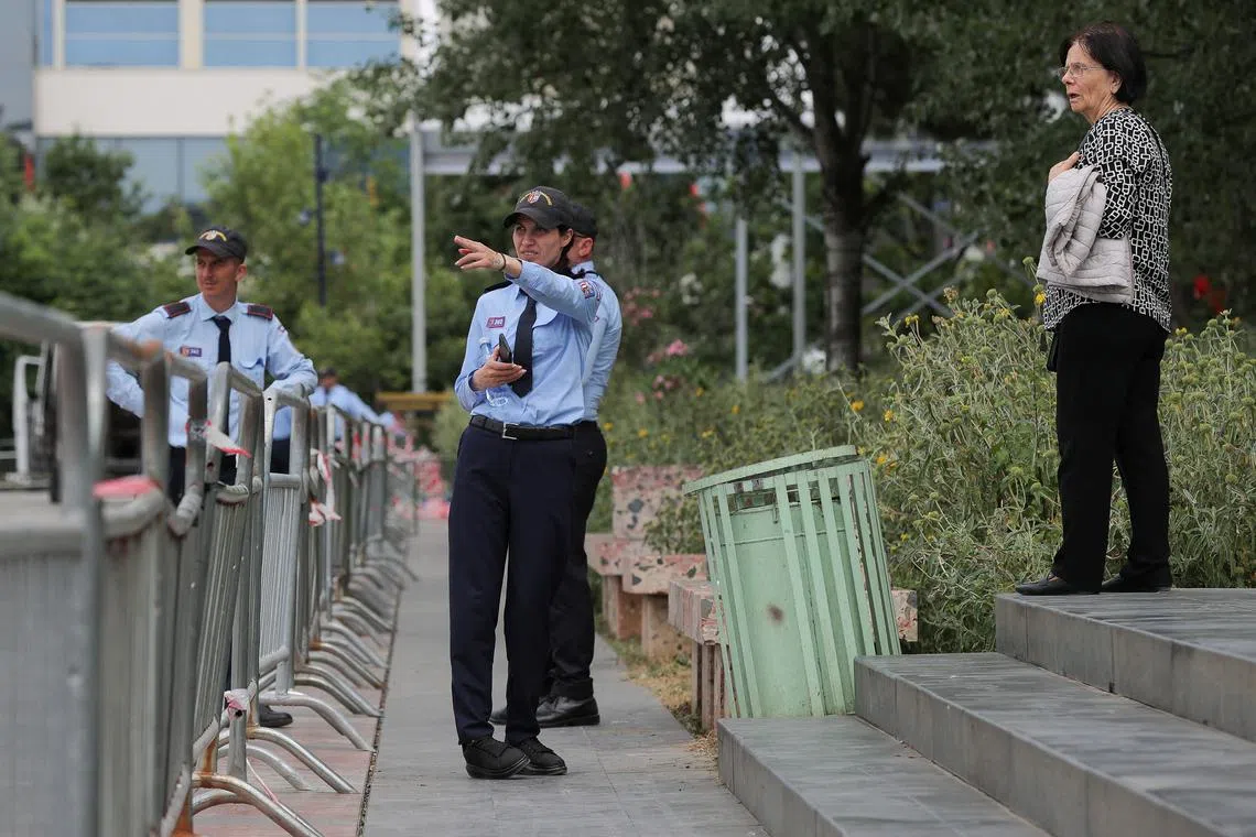 Police officers stand guard near barriers at the Skanderbeg square ahead of the European Political Community Summit in Tirana, Albania May 15, 2025. REUTERS/Valdrin Xhemaj
