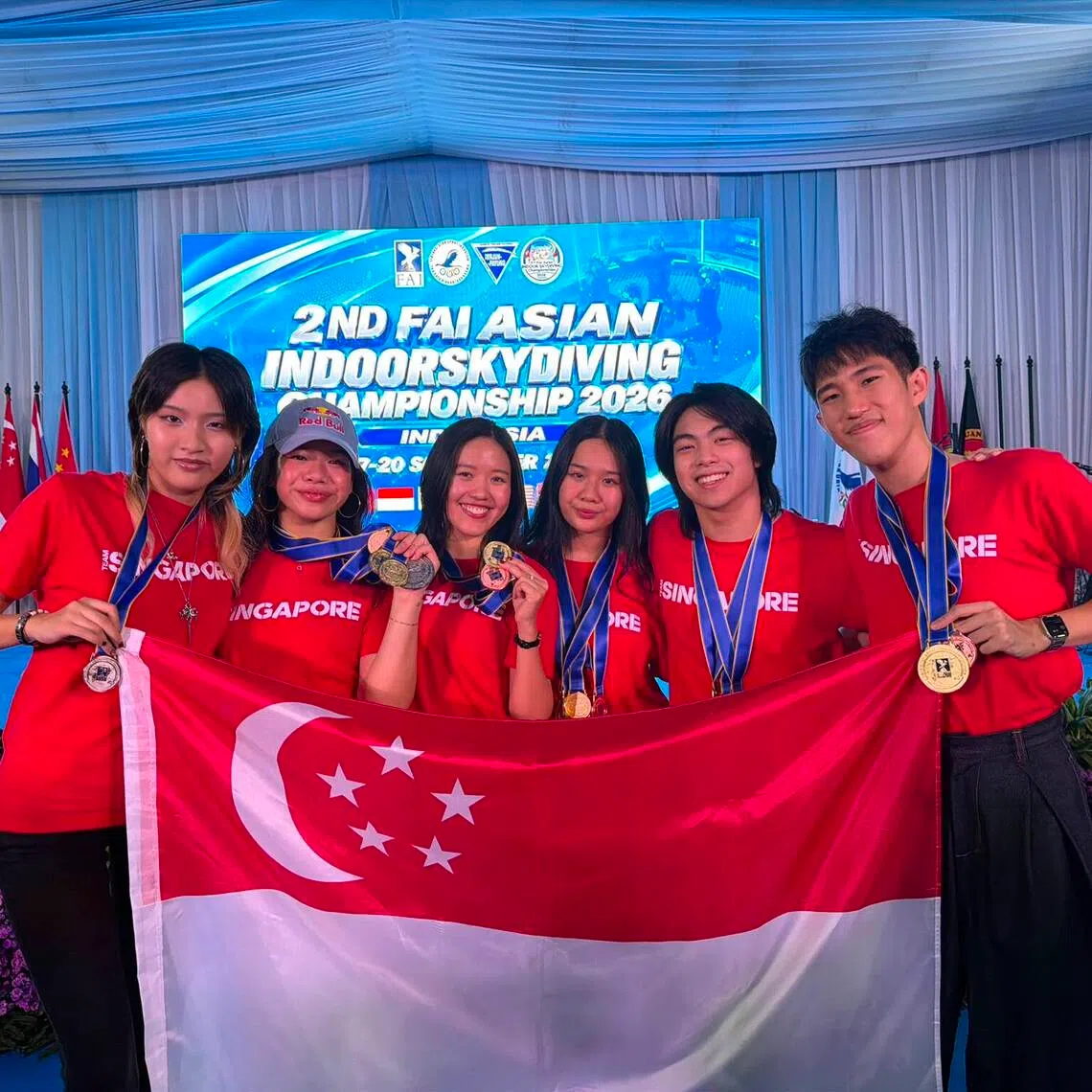 Singapore’s skydivers (from left: Isabelle Koh, Kyra Poh, Choo Yi Xuan, Vera Poh, Kai Minejima-Lee, Jordan Lee) won 11 medals at the FAI Asian Indoor Skydiving Championships.