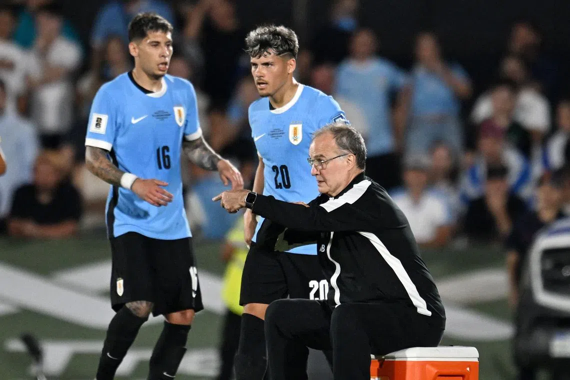 Uruguay head coach Marcelo Bielsa giving instructions to his players during a World Cup qualifier against Argentina.