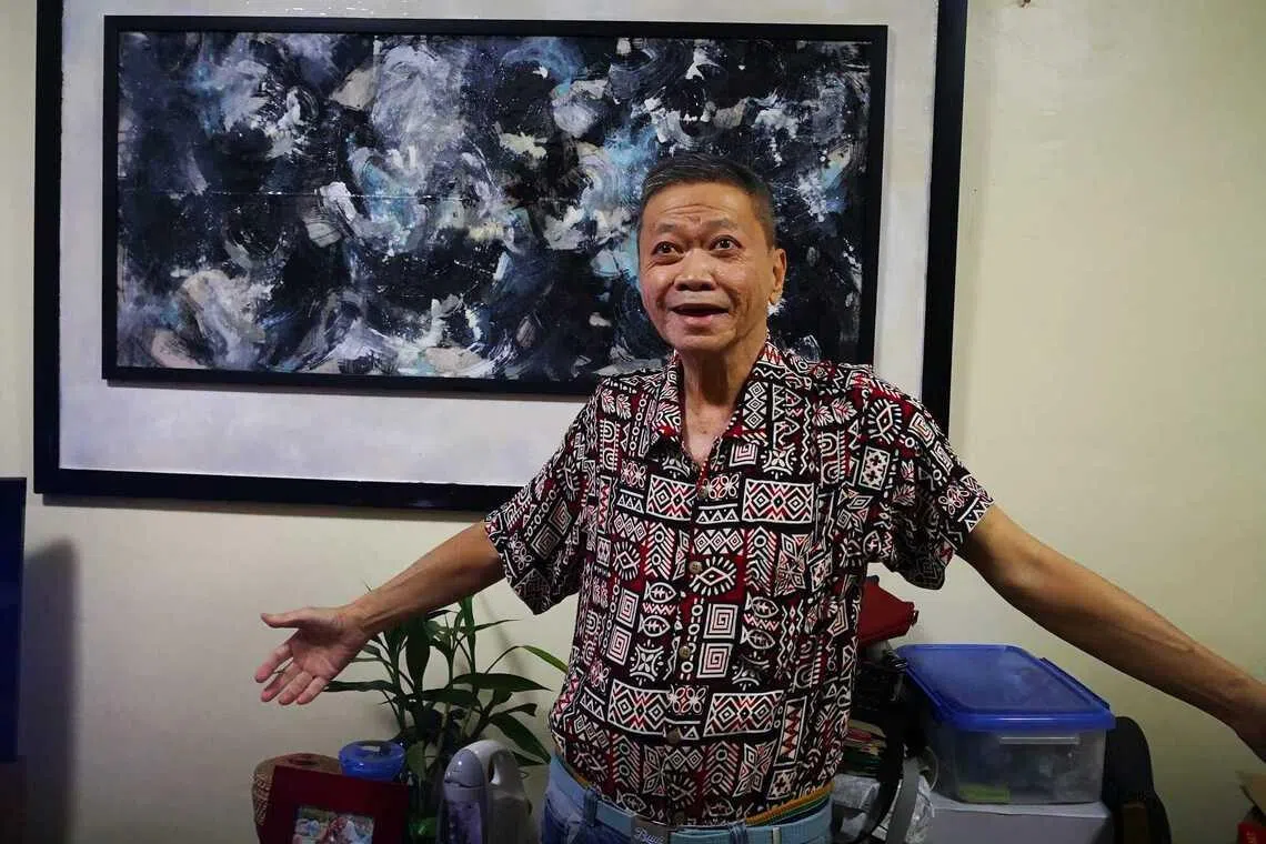Lim Hock Ann, aka Halim, with his abstract painting. 