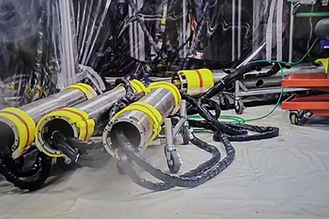 Pipes for the installation of a telescopic device to be used for the removal of radioactive debris at Fukushima Daiichi nuclear power plant. 