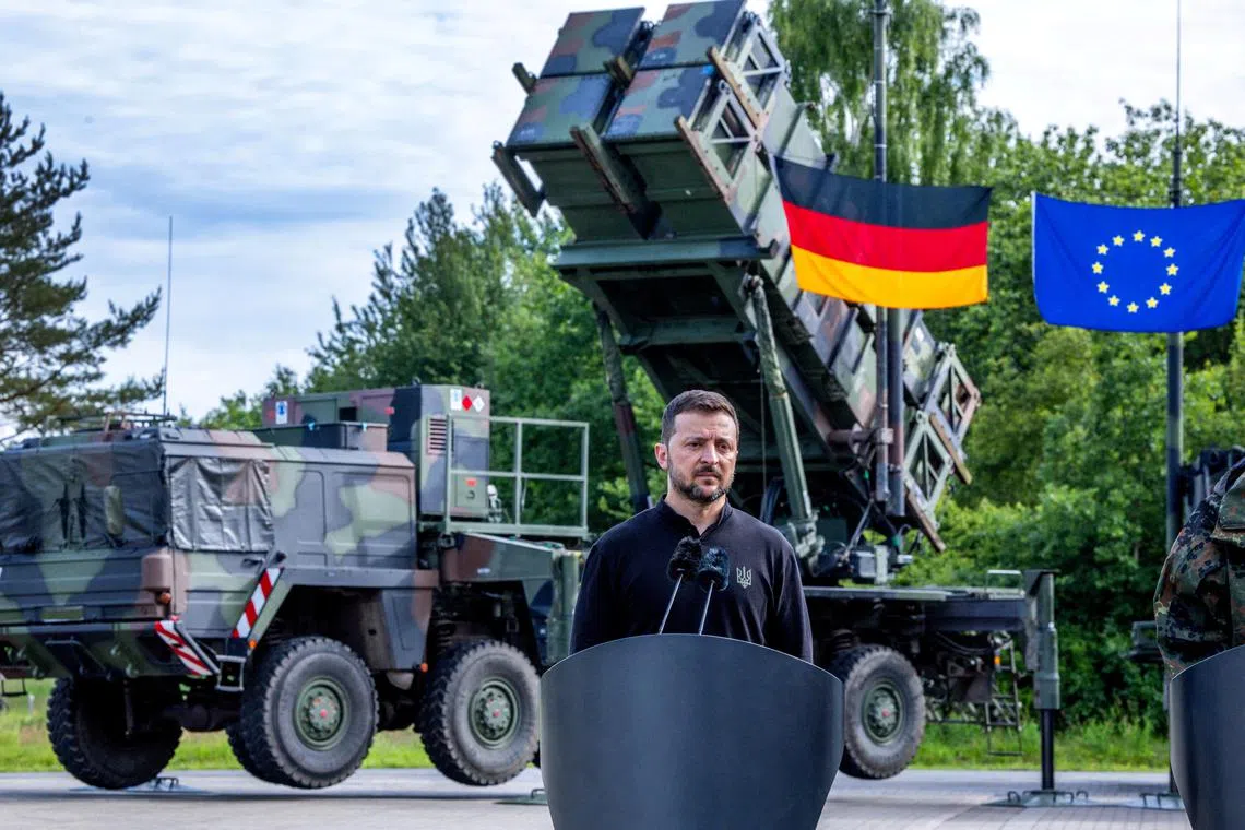 Ukrainian President Volodymyr Zelenskiy speaks during a visit to a military training area to find out about the training of Ukrainian soldiers on the “Patriot” anti-aircraft missile system, at an undisclosed location, in Germany, June 11, 2024.   Jens Buttner/Pool via REUTERS