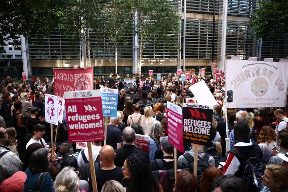 Protestors demonstrate outside the Home Office against the British Governments plans to deport asylum seekers to Rwanda, in London, Britain, June 13, 2022. REUTERS/Henry Nicholls/File Photo