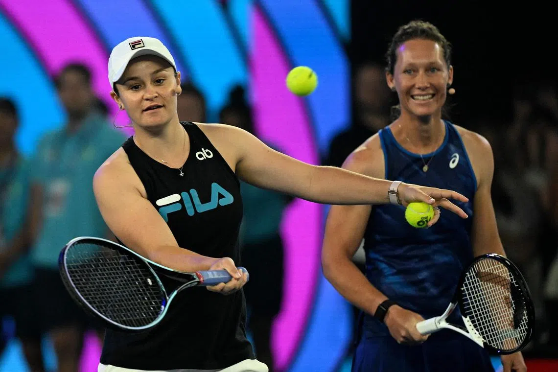 Retired former world No. 1  tennis player Ashleigh Barty (left) and fellow Australian Samantha Stosur at the "Kids Tennis Day" in Melbourne on Jan 14, 2023, ahead of the Australian Open