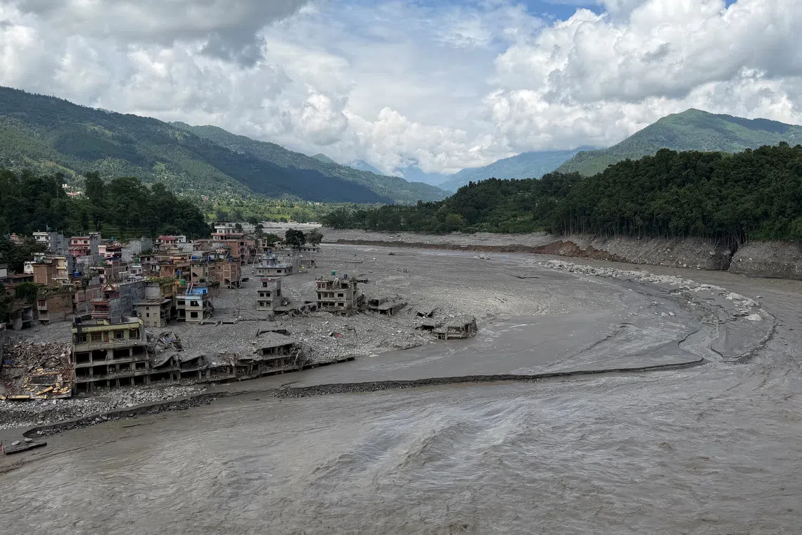Damaged properties along the Trishuli River where the Tribhuvan Trishuli Secondary School once stood, before it was destroyed by deadly flash floods and mudslides, in Nuwakot, Nepal, August 31, 2026. REUTERS/Sunil Kataria