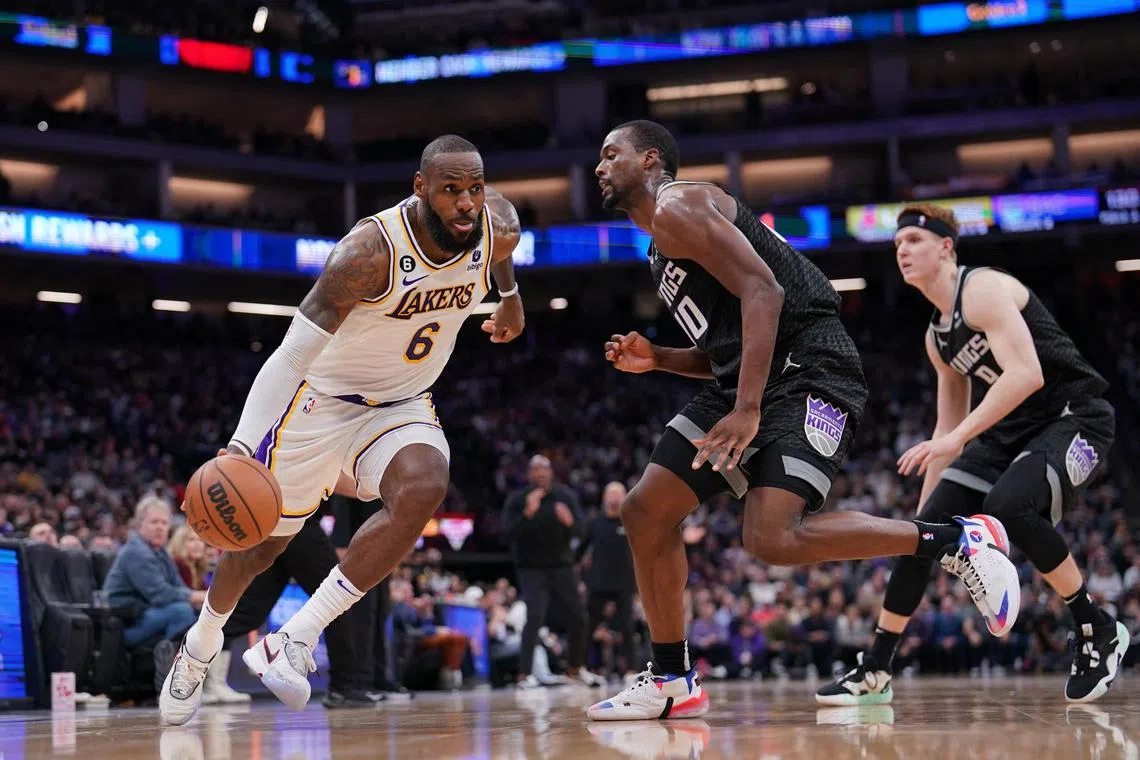 Los Angeles Lakers forward LeBron James dribbles past Sacramento Kings forward Harrison Barnes in the fourth quarter at the Golden 1 Centre.