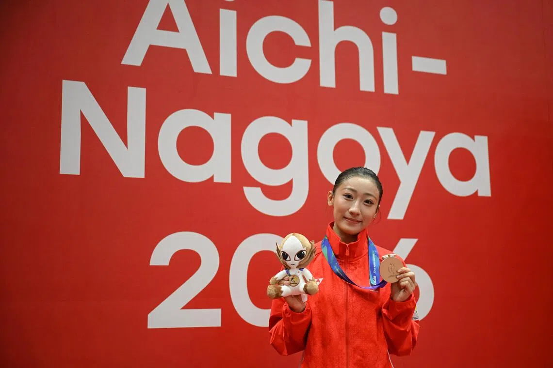 Zeanne Law of Singapore with her joint bronze medal after the Asian Games Wushu Women?s Taijiquan and Taijijian Final held at the Aichi Prefectural Martial Arts Hall on Sept 20, 2026.