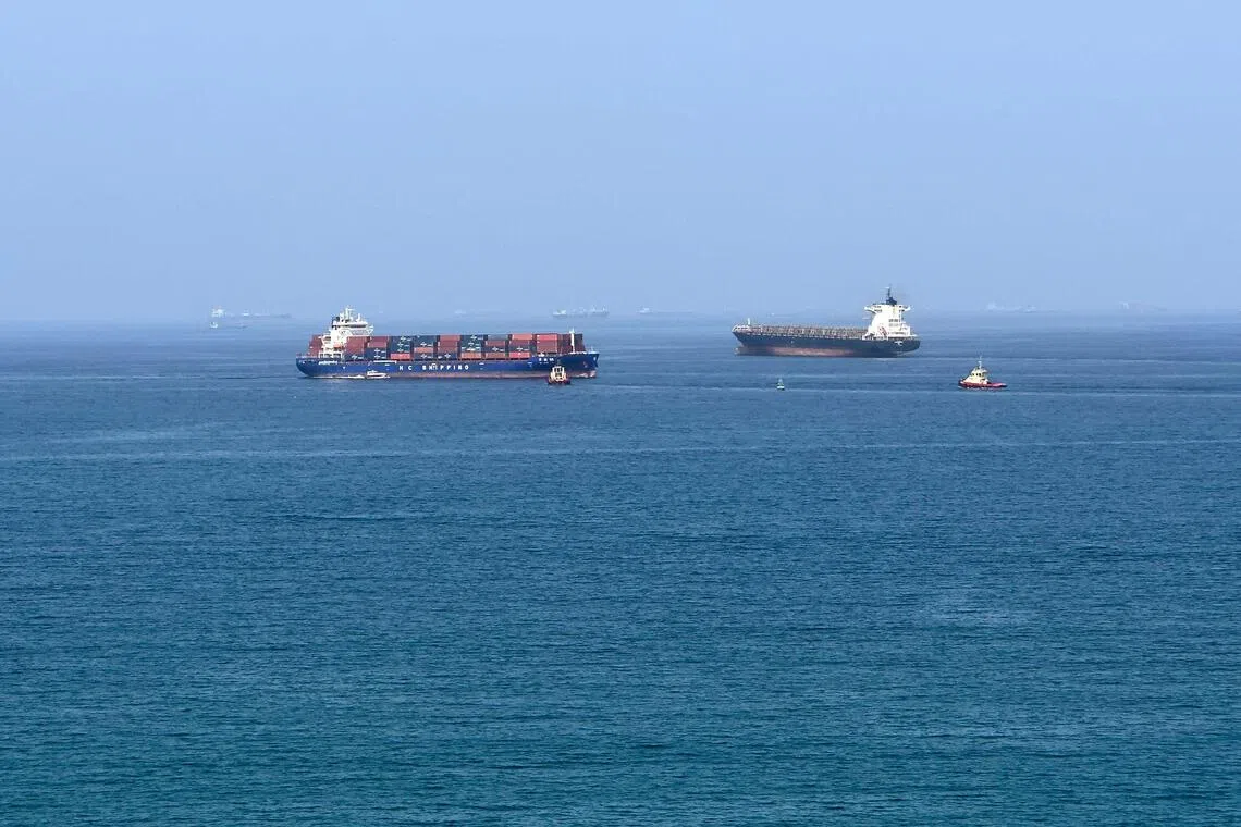 Image 10: In response to the US-Israel attacks, Iran closed the vital Strait of Hormuz, effectively trapping dozens of ships and sailors.