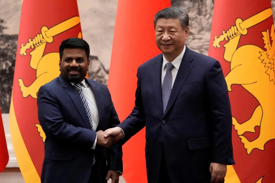 Chinese President Xi Jinping and Sri Lankan President Anura Kumara Dissanayake shake hands during a signing ceremony at the Great Hall of the People in Beijing, China on Wednesday, Jan 15, 2025.  Aaron Favila/Pool via REUTERS